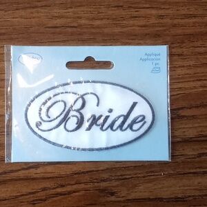 Bride applique. Measures 3.25 inches by 1.75 inches.